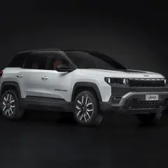 Biały Jeep Compass na ciemnym tle. Zwróć uwagę na jego nowoczesny design i wymiary, idealne do miasta i w teren.